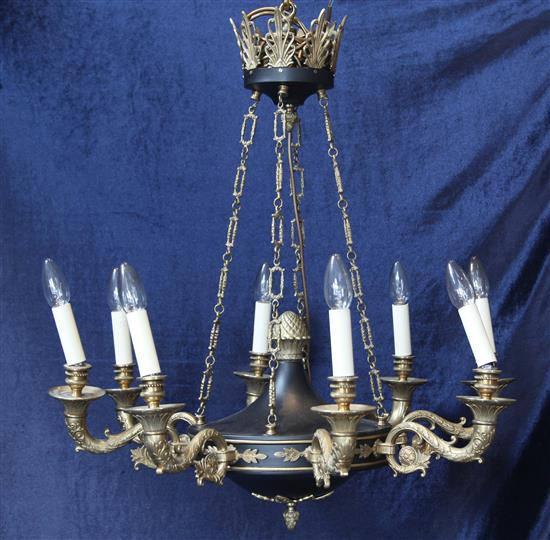 An Empire style brass and bronzed eight light chandelier plus two lights